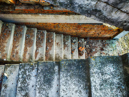 Abandoned building. Creepy and scary old factory. Stairs in an abandoned building.
