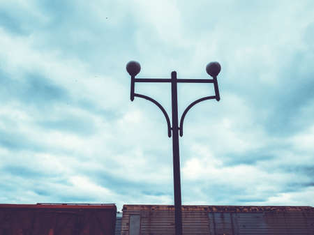 Street lamp against the blue sky. Dull sky.の写真素材