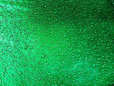 Raindrops for background. Color tinting. Light leaks. Water drops on background.の写真素材