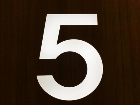 Number 5 on the front of the house, close up.の写真素材