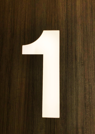 Number 1 on the front of the house, close up.