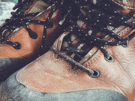 Old red dirty high shoes . Old school vintage worn boots.の写真素材