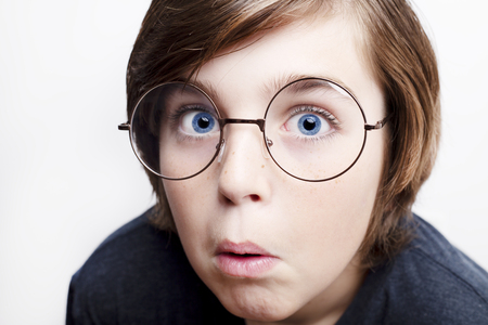 Handsome boy is wearing eyeglasses. Isolated on white background.の写真素材