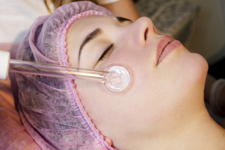 Woman in spa salon lying down and enjoy relaxing in the day spa. Different treatments at the spa.