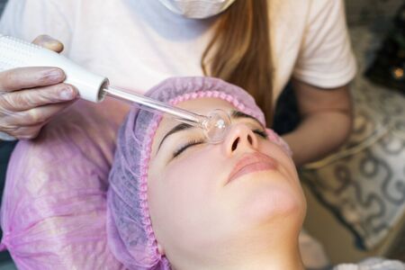Woman in spa salon lying down and enjoy relaxing in the day spa. Different treatments at the spa.の写真素材