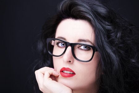 Image of a beautiful young woman wearing glasses.
