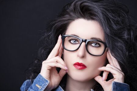 Image of a beautiful young woman wearing glasses.