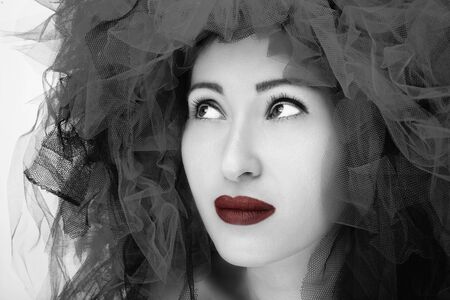 Portrait of beautiful young woman. Fashion photo in black and white effect.