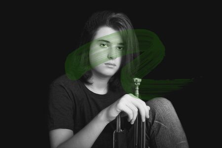 Portrait of a teenager with trumpet in studio