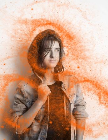 Portrait of a teenager wearing a blue jacket in studioの写真素材