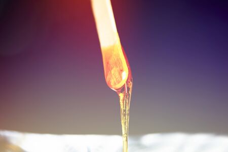 close-up sugar paste for hair removal on a black backgroundの写真素材