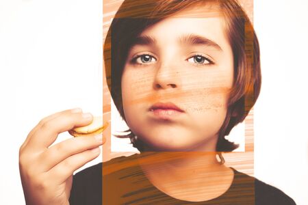 Handsome boy holds in his hands macaroni over white background