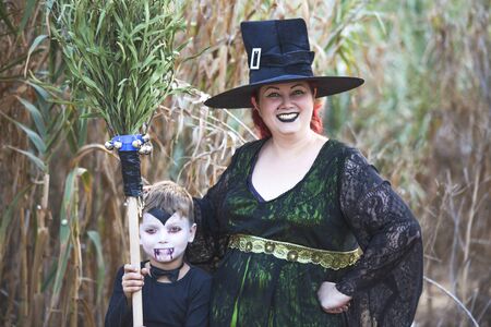 Portrait of a woman with a child with horror makeup for Halloween