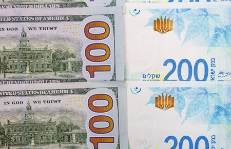 Israeli and American banknotes. Shekel and American dollars