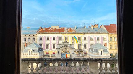 LVIV, UKRAINE - DECEMBER 7, 2019: View of the beautiful courtyard through a large windowの写真素材