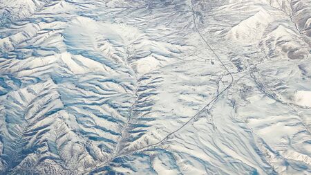 Beautiful view of the landscape from the window of an airplaneの写真素材