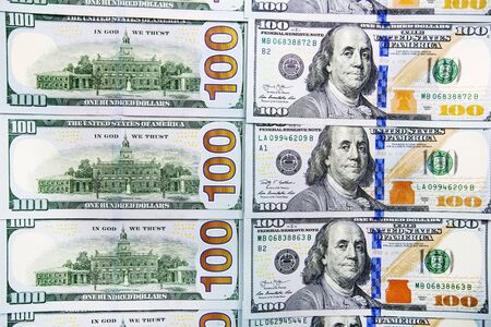 A pile of  US banknotes with president portraits. Cash of  dollar bills, dollar background image.
の写真素材