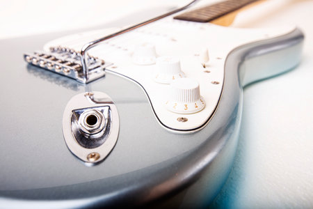 Silver electric guitar isolated on white background. High quality photoの写真素材