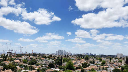 View from the window. City view over blue sky and white clouds. High quality photo.の写真素材