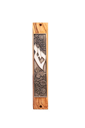 A Jewish Wooden Mezuzah contains specific Torah verses and is placed on the doorframe of homes.の写真素材