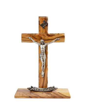 Wooden crucifix standing on white backgroundの写真素材