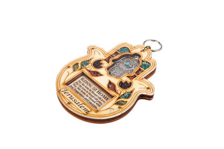 Wooden hamsa for blessing with colorful stones isolated on white backgroundの写真素材