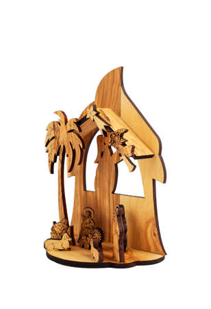 Carved wooden Nativity scene with Jesus isolated on white backgroundの写真素材