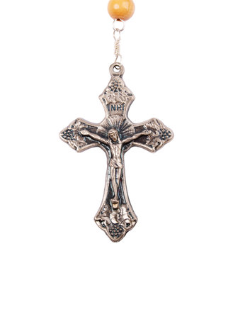 Silver crucifix close-up isolated on white backgroundの写真素材