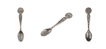 Set of Three Amulets of Wealth Wallet Spoon Silver 925 Money Talisman on wallet isolated on white backgroundの写真素材