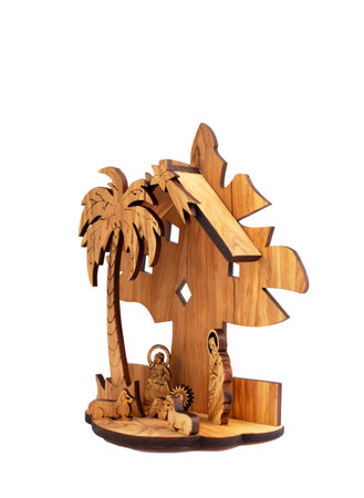 Carved wooden Nativity scene with Jesus isolated on white backgroundの写真素材