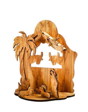 Carved wooden Nativity scene with Jesus isolated on white backgroundの写真素材