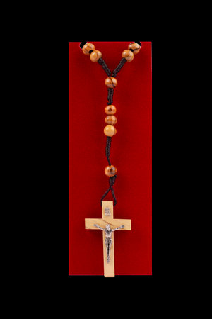 Traditional Christian holy religious wooden rosary isolated on black backgroundの写真素材