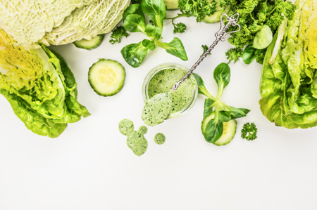 Yogurt smoothie with green vegetables, food background, top view, frameの写真素材
