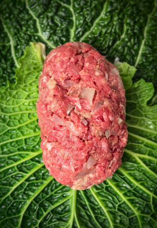 stuffed cabbage leaf, preparation with meat filling, top view