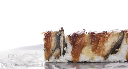 five sushi rolls with smoked eel , isolatedの写真素材