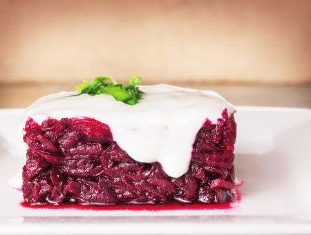 Beet salad with sour cream, square shape, sideviewの写真素材