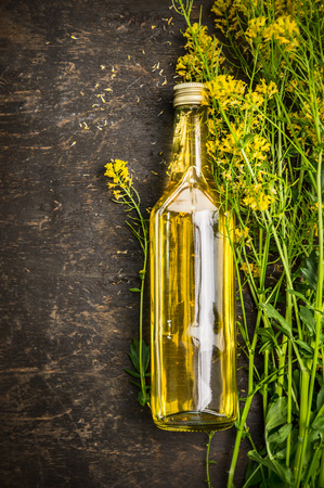Bottle of Rape oil on rustic wooden background Top Viewの写真素材