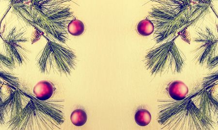 Christmas background with deco baubles and fir branches , vitage toned