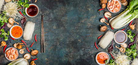 Asian food background with various of cooking ingredients on rustic background , top view , banner.  Asian food concept: Chinese or Thai cuisine.の写真素材