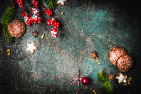 Christmas vintage background with fir branches, cookies and gingerbreads, top view frameの写真素材