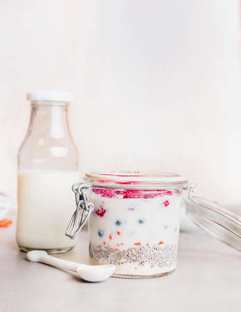 Healthy breakfast  in glass on light background, front viewの写真素材