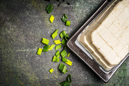 Diced Silken tofu on rustic background, top view, close upの写真素材