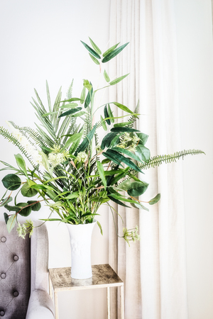 Home decoration with white vase and green indoor plant bunch, patio potの写真素材