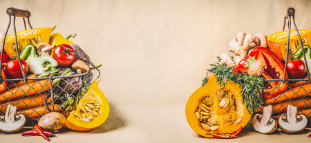 Pumpkin and organic seasonal harvest vegetables for vegetarian and healthy cooking, front view, bannerの写真素材