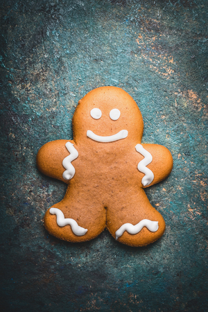 Gingerbread man cookie on rustic background, top viewの写真素材