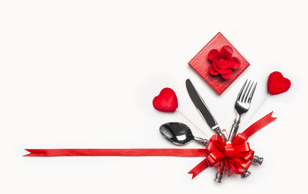 Gift box and hearts on white background, banner. Layout for valentines day dinner invitation or anniversary, banquet, celebratの写真素材