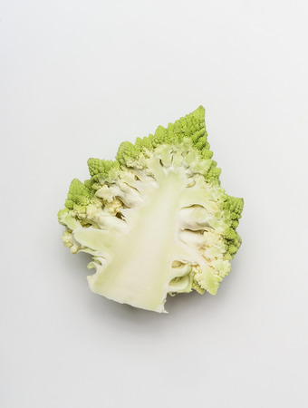 Close up of half head of Romanesco  broccoli cabbage on white background, top viewの写真素材