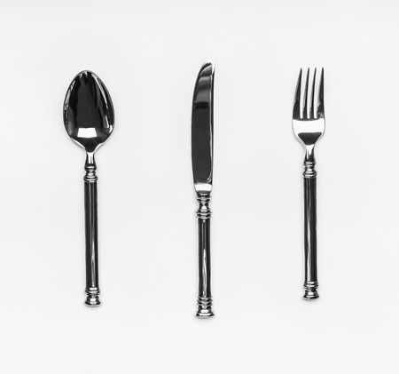 Table silverware cutlery setting with fork,knife and spoon on white background, top viewの写真素材