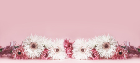 Floral border or template background with beautiful flowers bunch at pinkの写真素材