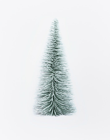 Decorative artificial christmas tree on white backgroundの写真素材